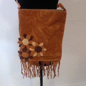 Tan shoulder bad with flower embellishments